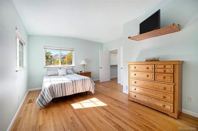 a bedroom with a bed and chair