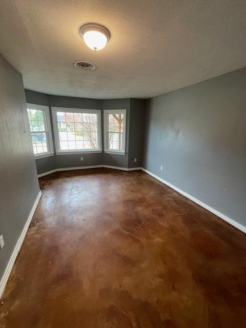 200 East 23rd Street Littlefield, TX 79339 - Photo 17 of 22 an empty room with a empty space and windows
