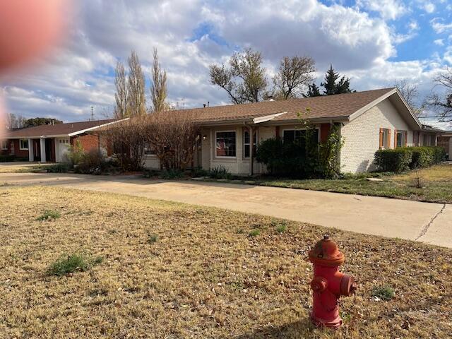 200 East 23rd Street Littlefield, TX 79339 - Photo 2 of 22 a front view of a house with a yard