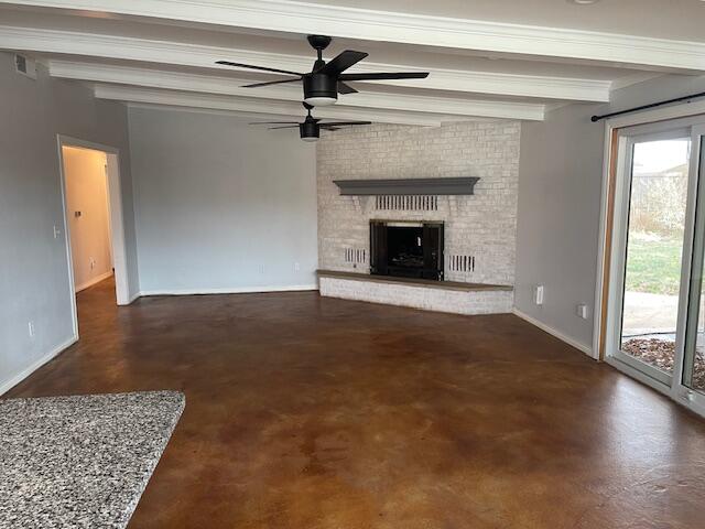 200 East 23rd Street Littlefield, TX 79339 - Photo 5 of 22 a view of an empty room with wooden floor fireplace and a window