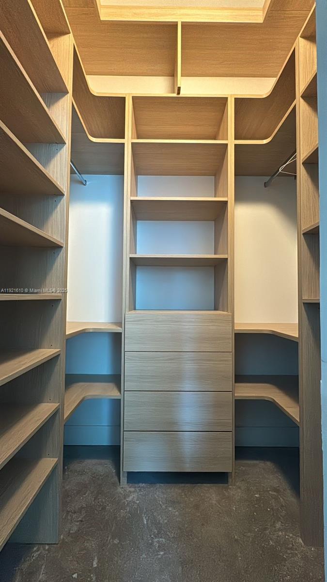 1900 North Bayshore Drive, Unit 909 Miami, FL 33132 - Photo 17 of 23 a view of walk in closet with empty racks