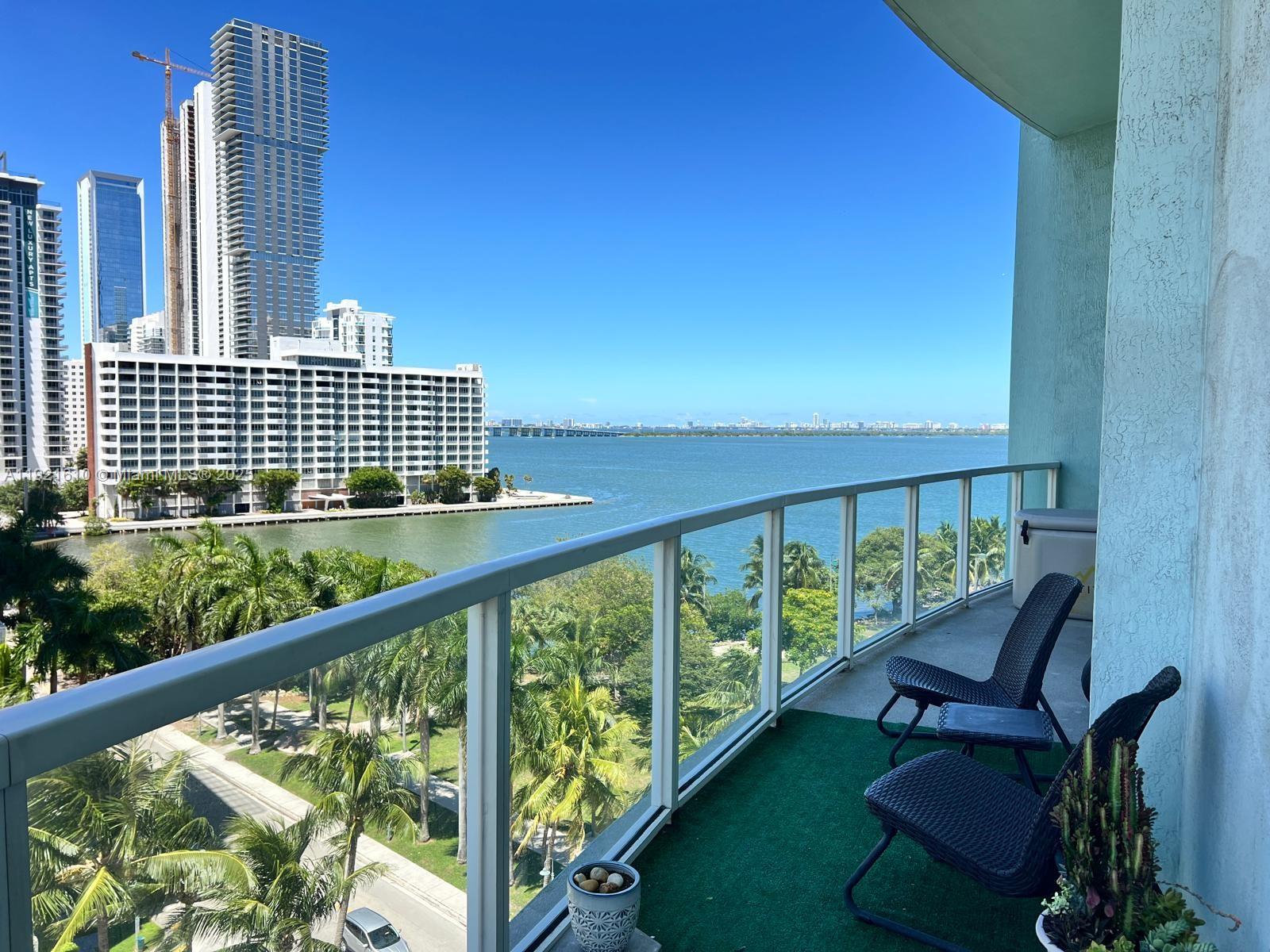 1900 North Bayshore Drive, Unit 909 Miami, FL 33132 - Photo 20 of 23 a view of a balcony with chairs
