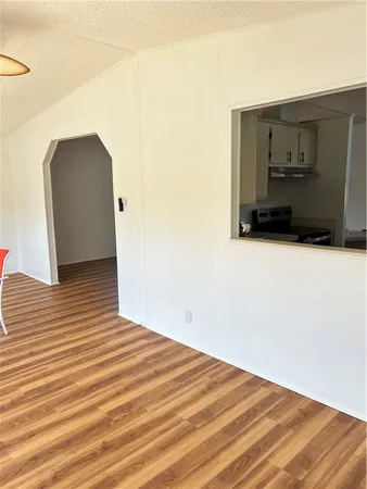 a view of a livingroom with wooden floor