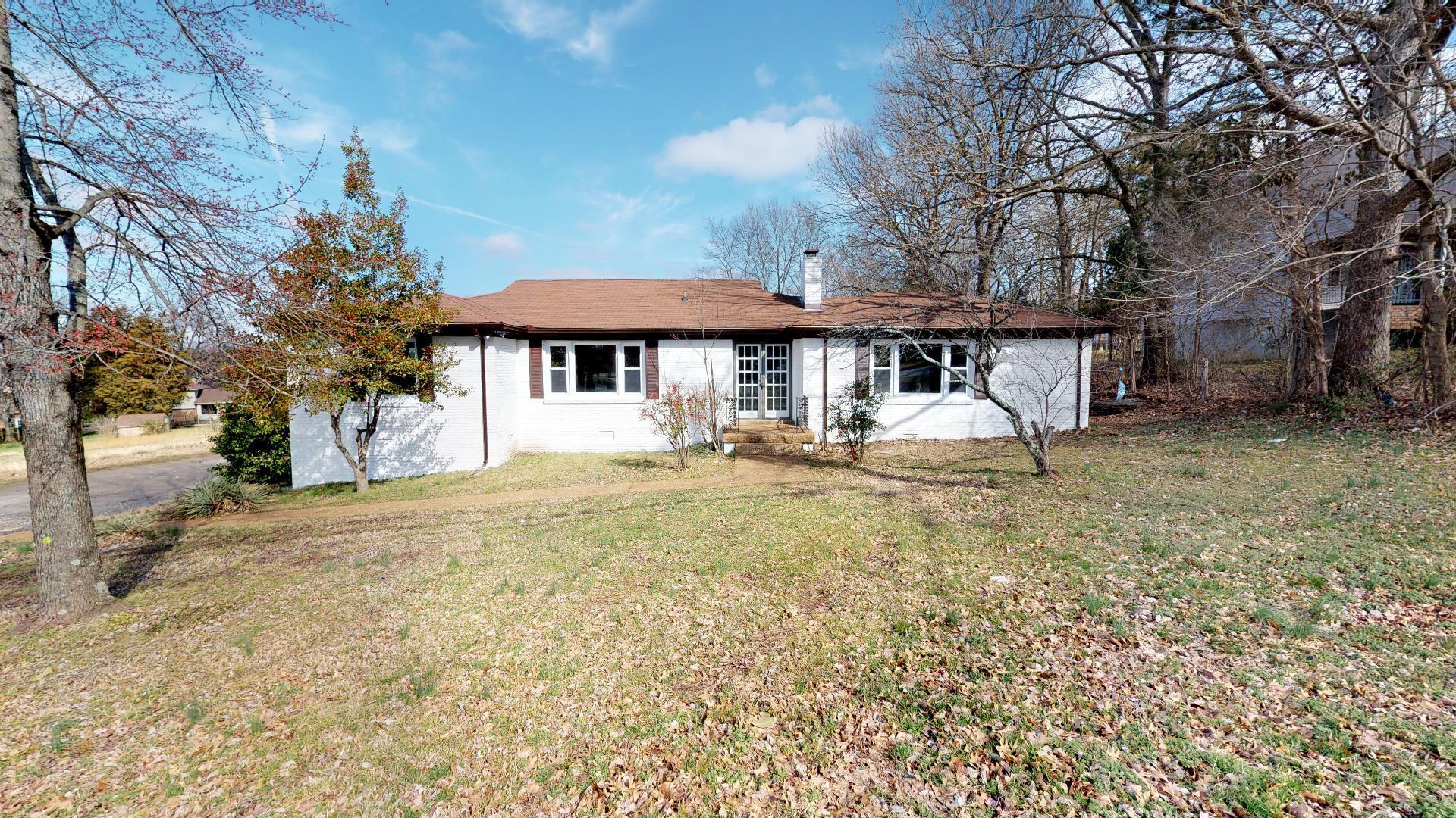 3064 Anderson Road Nashville, TN 37217 - Photo 2 of 29 a front view of a house with garden