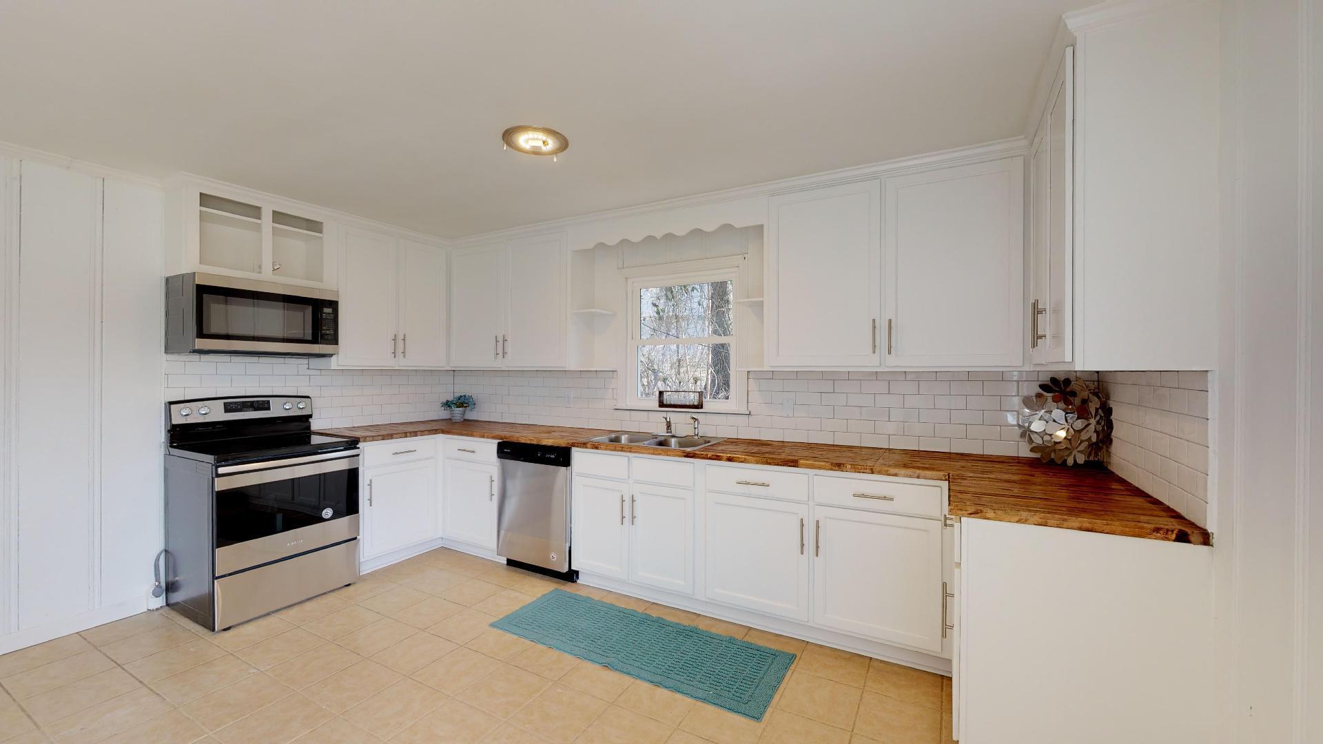 3064 Anderson Road Nashville, TN 37217 - Photo 13 of 29 a kitchen with a sink stove and microwave