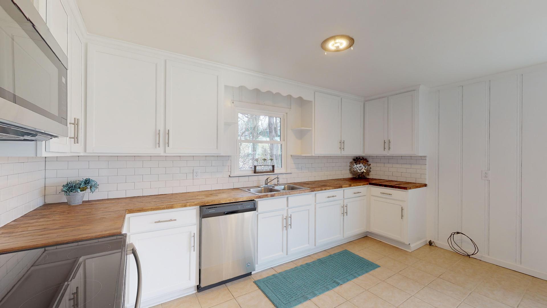 3064 Anderson Road Nashville, TN 37217 - Photo 14 of 29 a kitchen with a sink cabinets and a window