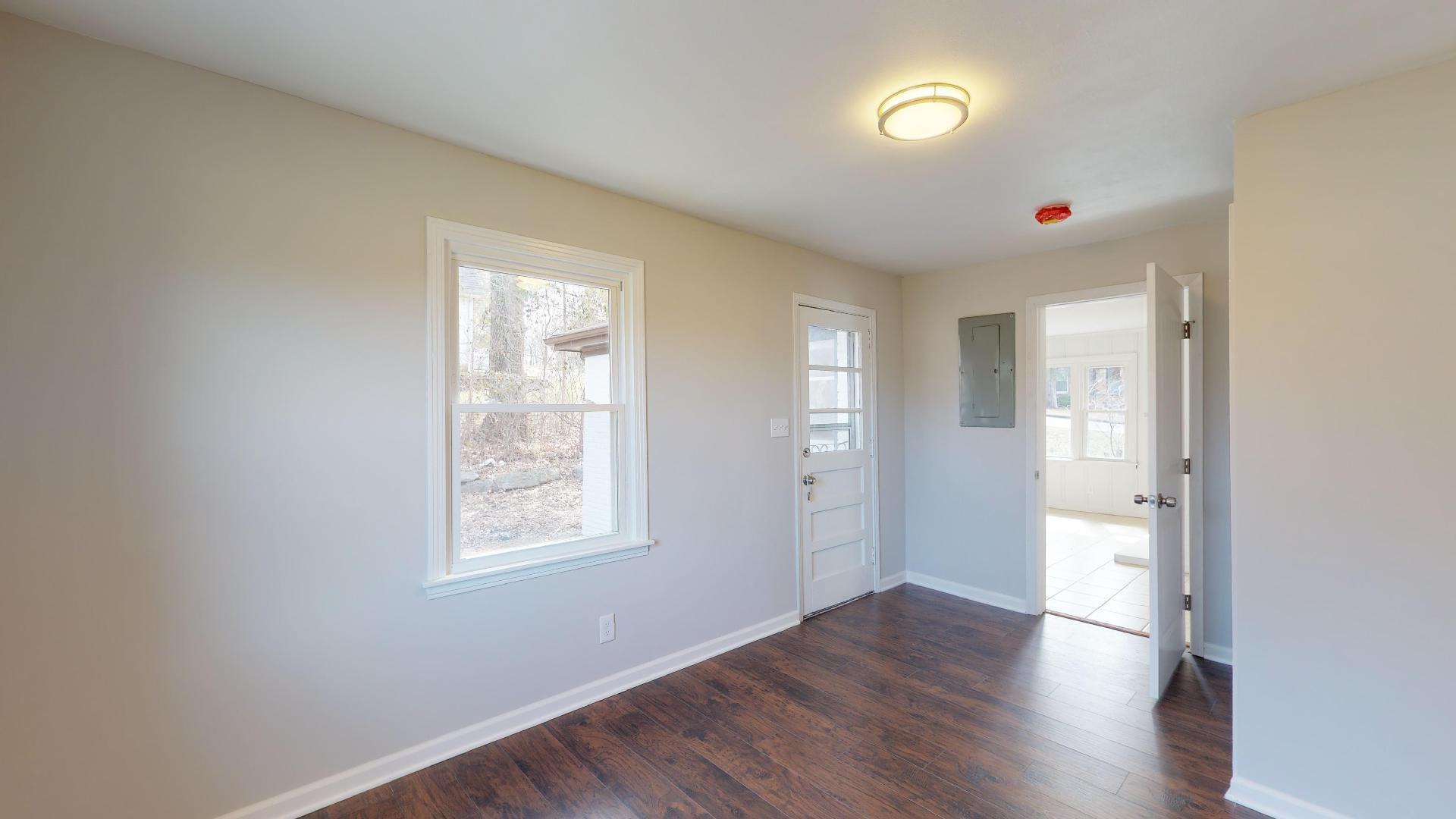 3064 Anderson Road Nashville, TN 37217 - Photo 17 of 29 an empty room with wooden floor and windows