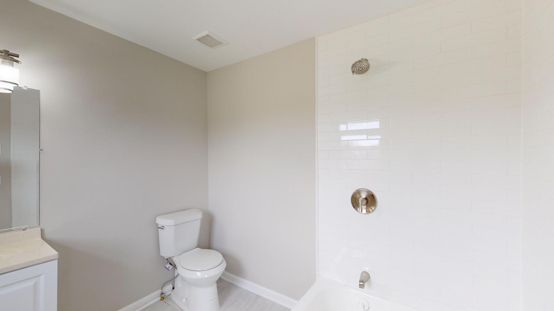 3064 Anderson Road Nashville, TN 37217 - Photo 20 of 29 a white toilet sitting next to a shower