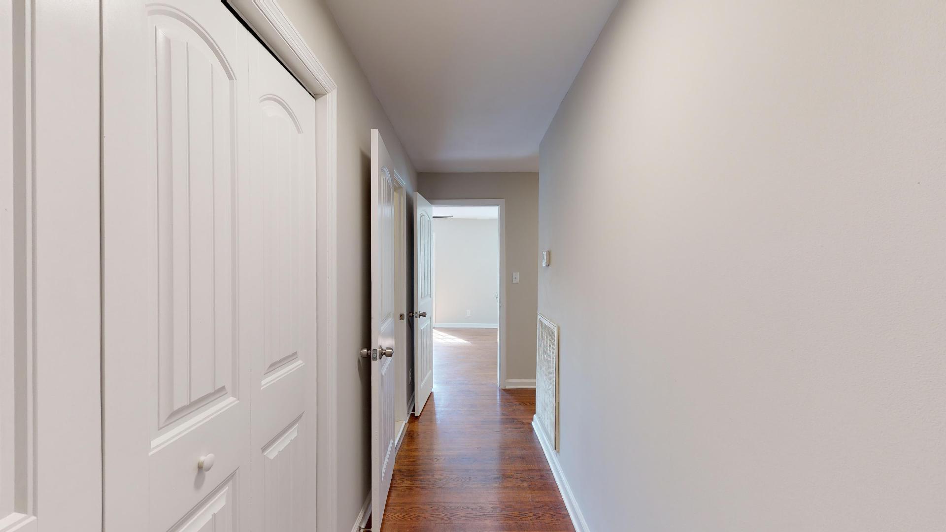 3064 Anderson Road Nashville, TN 37217 - Photo 3 of 29 a view of a hallway with wooden floor and staircase
