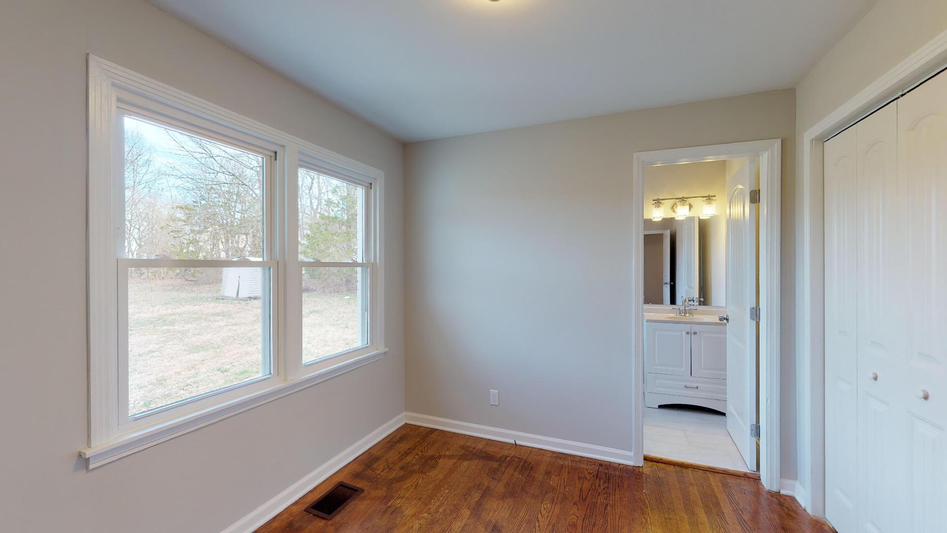 3064 Anderson Road Nashville, TN 37217 - Photo 22 of 29 an empty room with a window and wooden floor