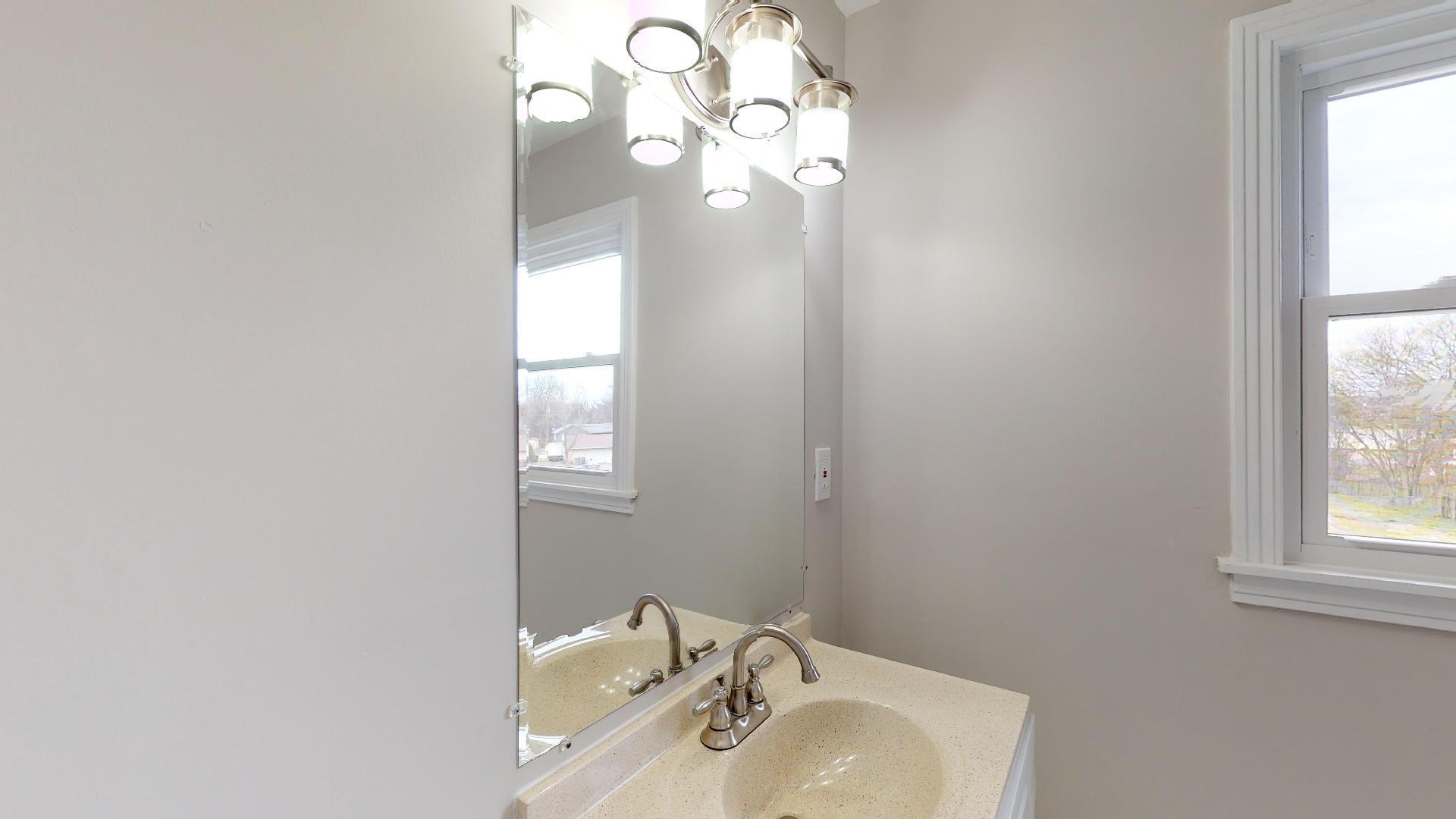 3064 Anderson Road Nashville, TN 37217 - Photo 27 of 29 a bathroom with a sink and a mirror