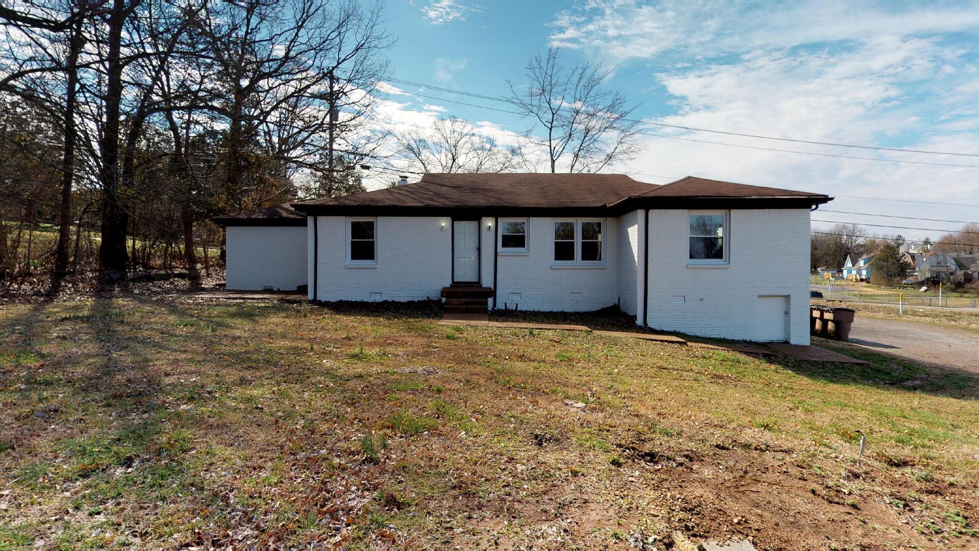 3064 Anderson Road Nashville, TN 37217 - Photo 28 of 29 a backyard of a house with yard and outdoor seating