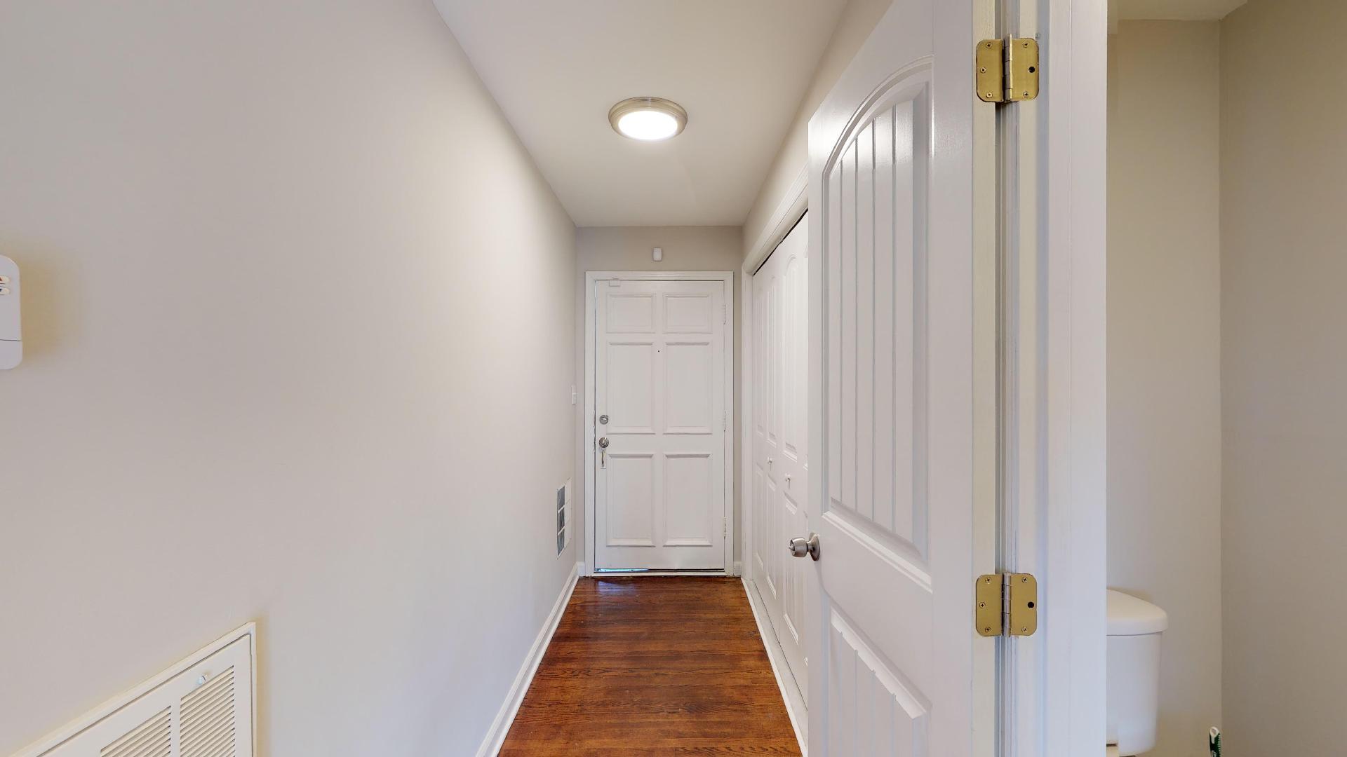 3064 Anderson Road Nashville, TN 37217 - Photo 4 of 29 a view of a hallway with wooden floor and staircase