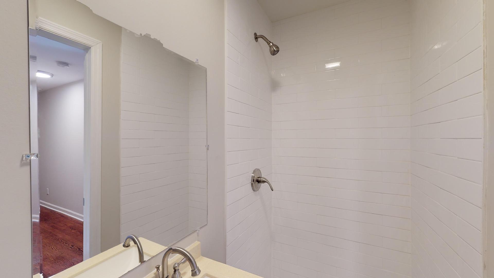 3064 Anderson Road Nashville, TN 37217 - Photo 5 of 29 a bathroom with a window and a shower