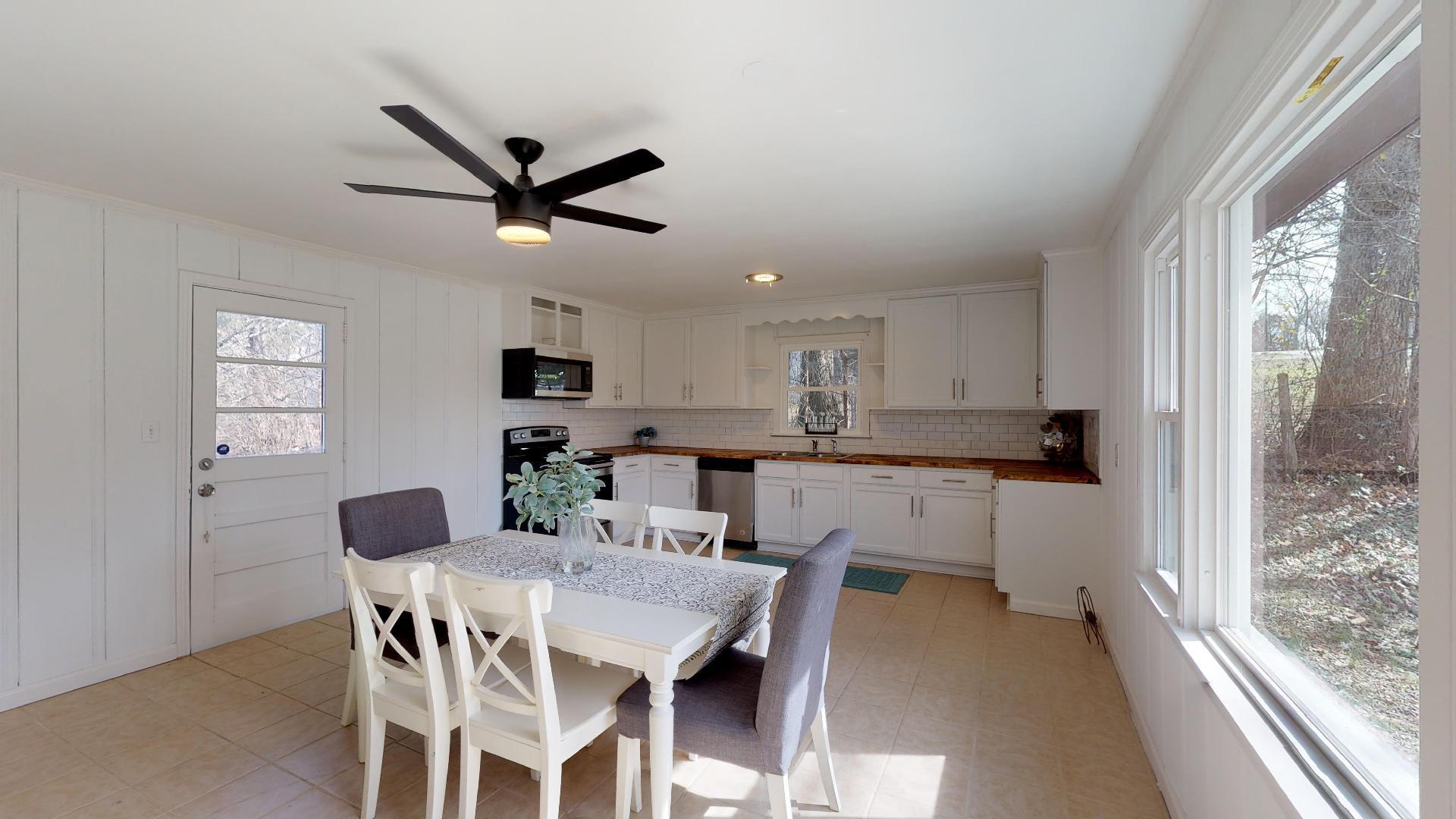 3064 Anderson Road Nashville, TN 37217 - Photo 10 of 29 a view of a dining room with furniture window and wooden floor