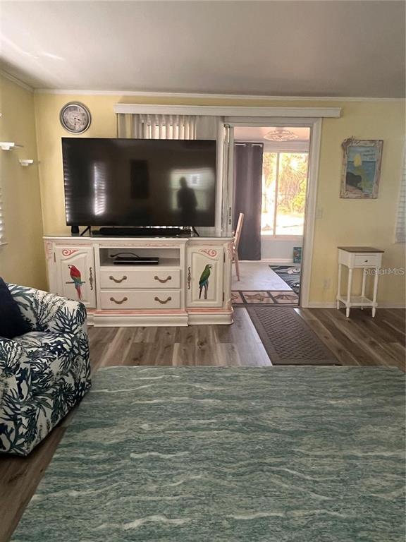 2295 North Beach Road, Unit 23 Englewood, FL 34223 - Photo 10 of 19 a living room with furniture and a flat screen tv
