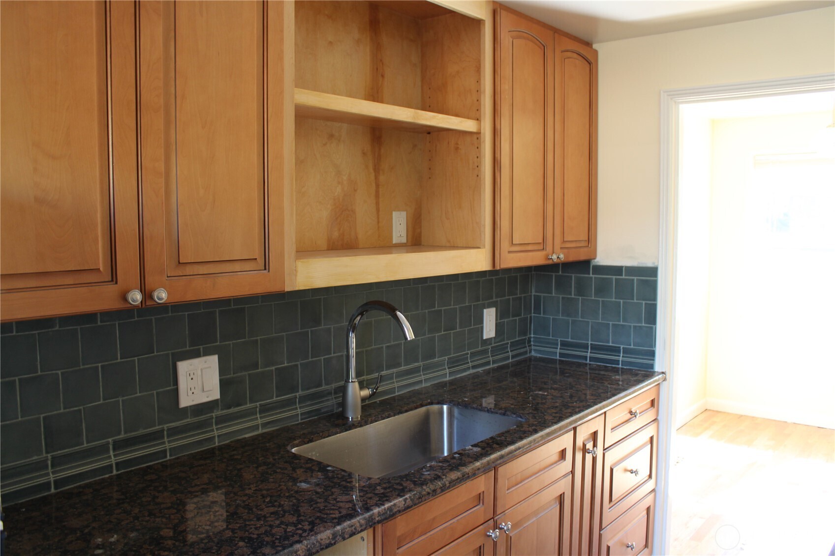 8001 Densmore Avenue North Seattle, WA 98103 - Photo 18 of 22 a kitchen with a sink and cabinets