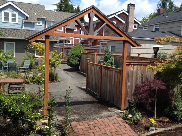 8001 Densmore Avenue North Seattle, WA 98103 - Photo 22 of 22 a front view of a house with garden