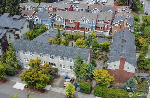 an aerial view of residential houses with outdoor space