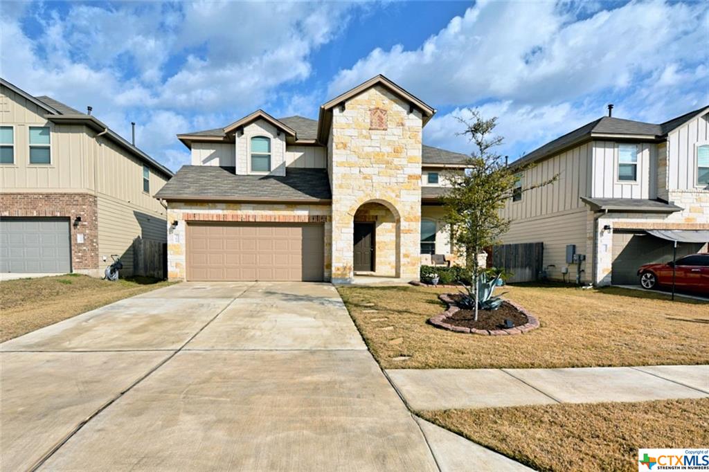 369 Limerick Road Buda, TX 78610 - Photo 1 of 1 front view of a house with a yard