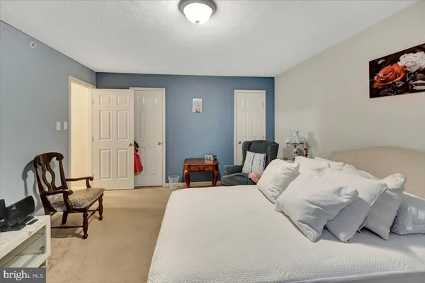 a bedroom with furniture and a window