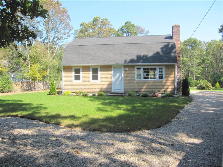560 Skunknet Road Centerville, MA 02632 - Photo 1 of 24 front view of house with a yard
