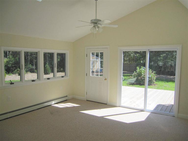 560 Skunknet Road Centerville, MA 02632 - Photo 13 of 24 a view of an empty room with a window