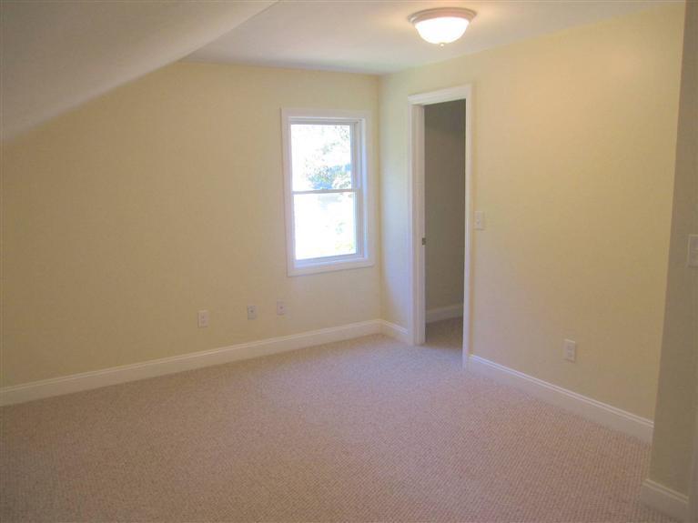560 Skunknet Road Centerville, MA 02632 - Photo 22 of 24 an empty room with windows and closet