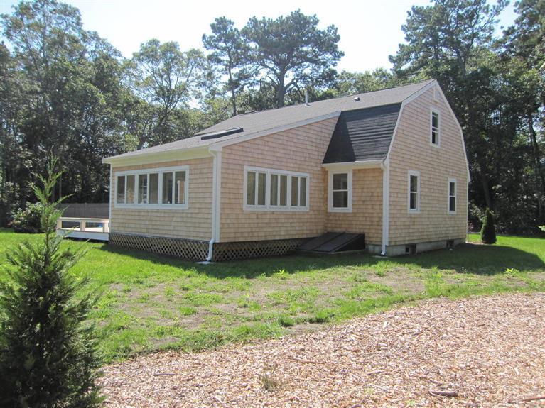 560 Skunknet Road Centerville, MA 02632 - Photo 4 of 24 a view of a house with a yard