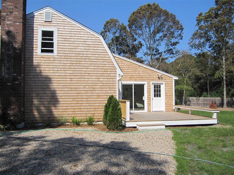560 Skunknet Road Centerville, MA 02632 - Photo 5 of 24 a view of a house with backyard