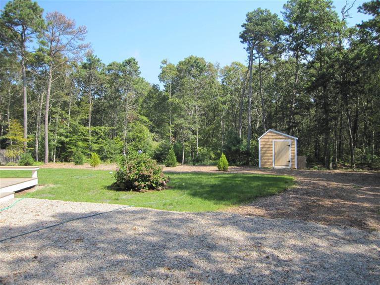 560 Skunknet Road Centerville, MA 02632 - Photo 6 of 24 a front view of a house with garden