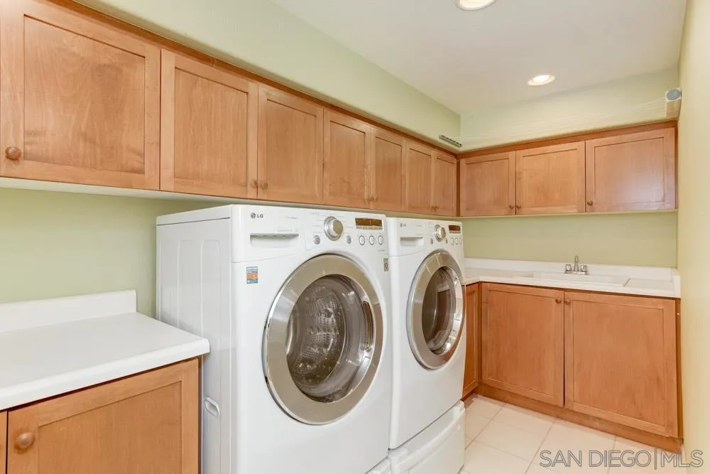 2737 MacKinnon Ranch Road Cardiff, CA 92007 - Photo 16 of 17 a utility room with dryer and washer