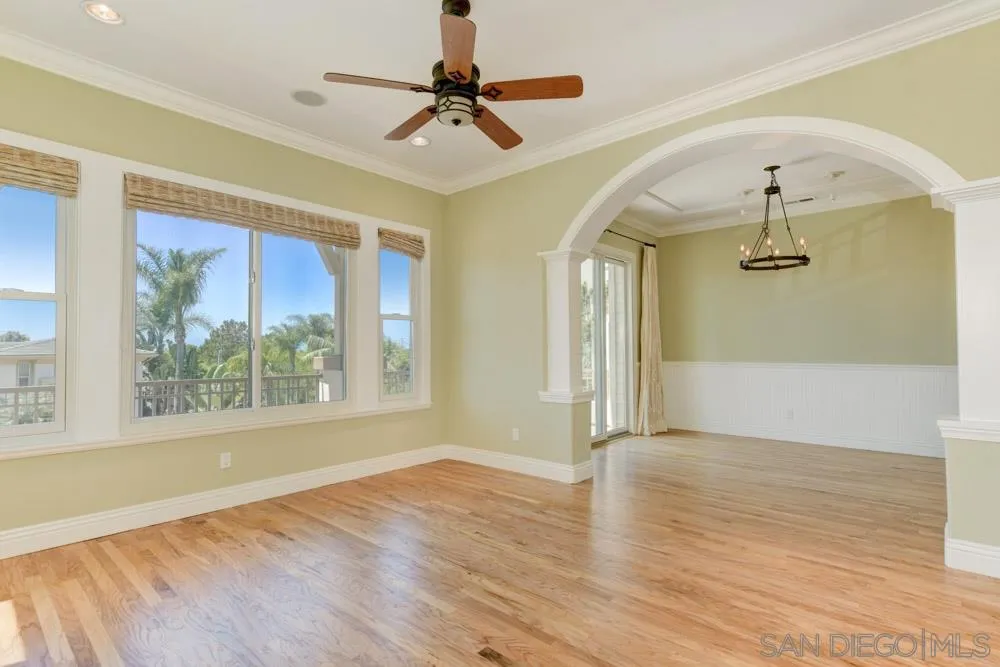 2737 MacKinnon Ranch Road Cardiff, CA 92007 - Photo 5 of 17 a view of empty room with wooden floor and fan