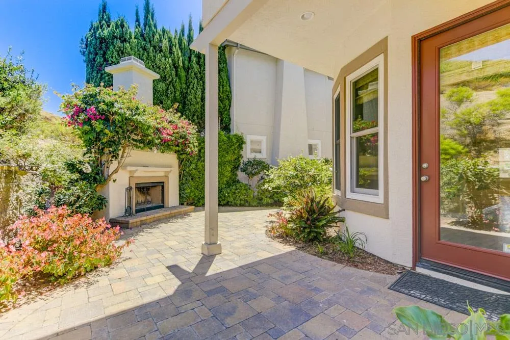 2737 MacKinnon Ranch Road Cardiff, CA 92007 - Photo 9 of 17 a view of a entryway door with flower in front of house