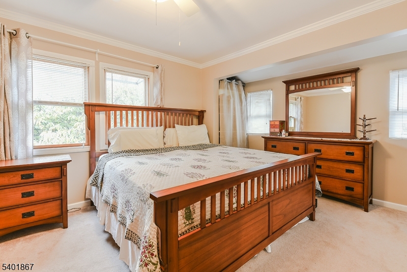 72 Rector Street Millburn, NJ 07041 - Photo 13 of 14 a bedroom with a bed and a dresser