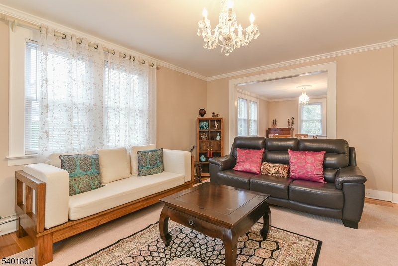 72 Rector Street Millburn, NJ 07041 - Photo 2 of 14 a living room with furniture and a chandelier