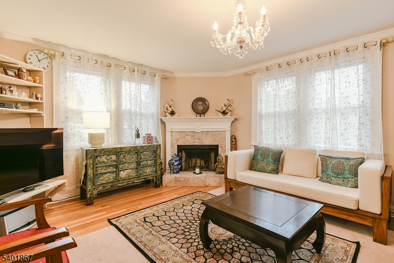 72 Rector Street Millburn, NJ 07041 - Photo 3 of 14 a living room with furniture and a fireplace
