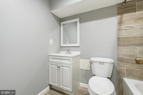 1006 K Street Northeast, Unit B Washington, DC 20002 - Photo 8 of 11 a bathroom with a toilet a sink and mirror