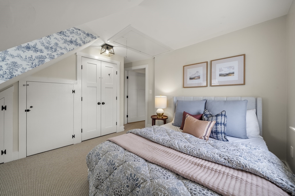11 Gingerbread Hill Marblehead, MA 01945 - Photo 17 of 20 a bedroom with a bed and a window