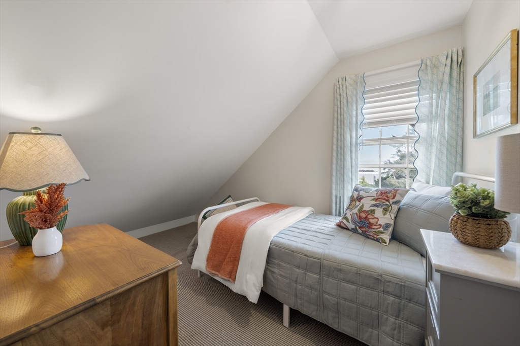 11 Gingerbread Hill Marblehead, MA 01945 - Photo 18 of 20 a bedroom with a bed and window