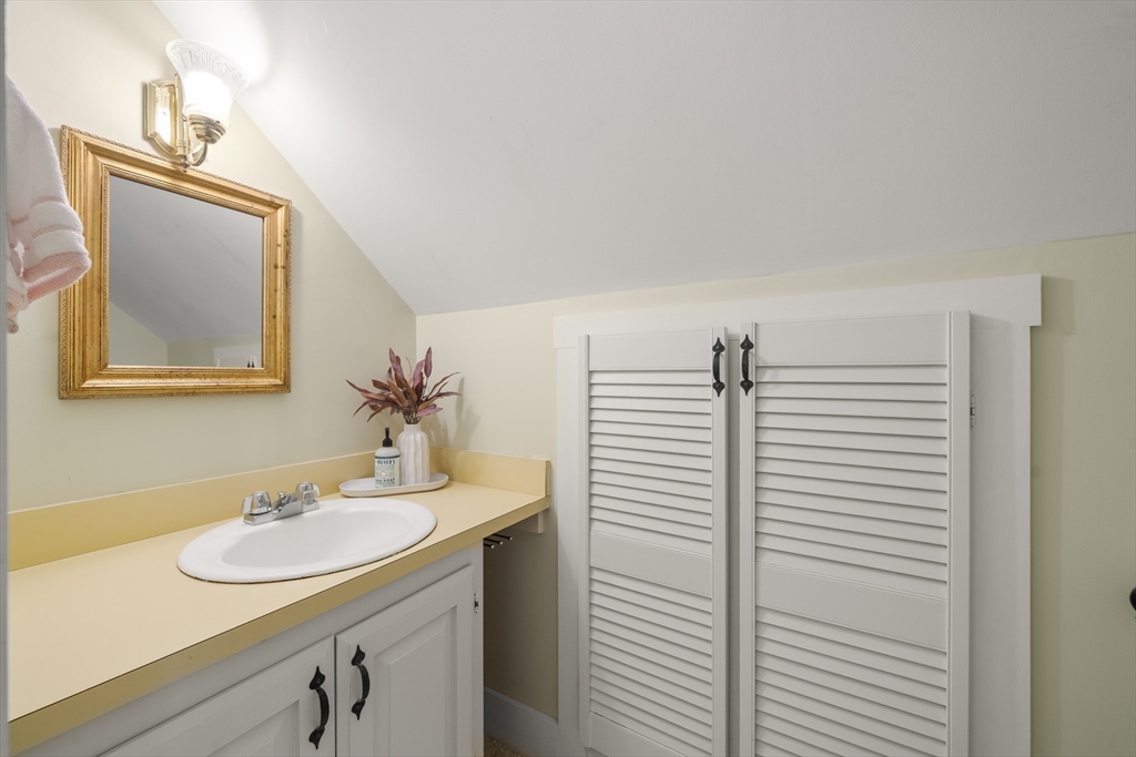 11 Gingerbread Hill Marblehead, MA 01945 - Photo 20 of 20 a bathroom with a sink and a mirror