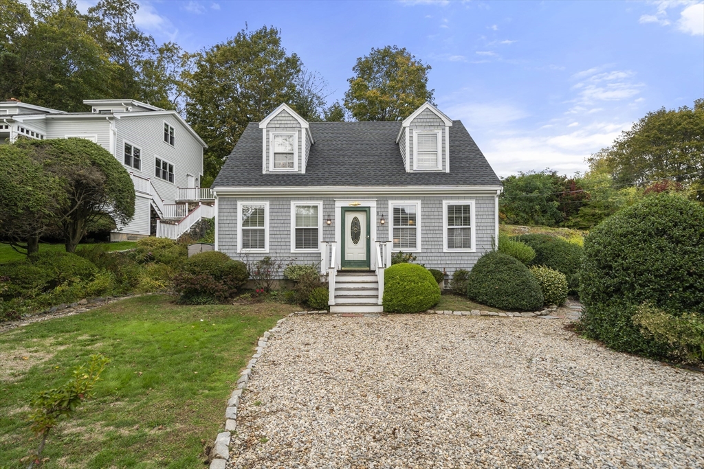 11 Gingerbread Hill Marblehead, MA 01945 - Photo 2 of 20 a front view of a house with a garden and plants