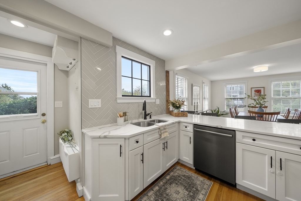 11 Gingerbread Hill Marblehead, MA 01945 - Photo 7 of 20 a kitchen with a sink stove and cabinets
