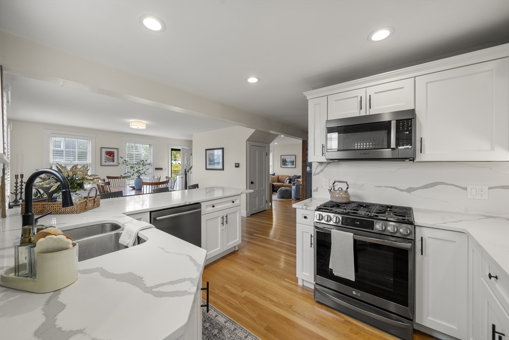 11 Gingerbread Hill Marblehead, MA 01945 - Photo 9 of 20 a kitchen with stainless steel appliances a stove a sink a microwave a refrigerator cabinets and a microwave