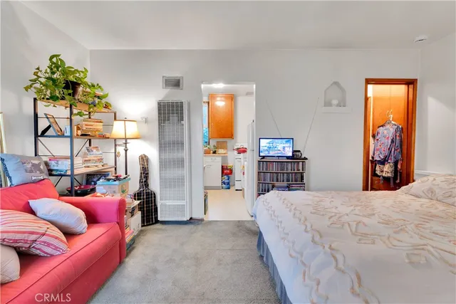 a bed room with a bed and a couch