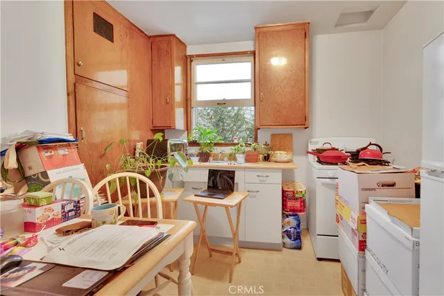 a kitchen that has a sink and a stove in it