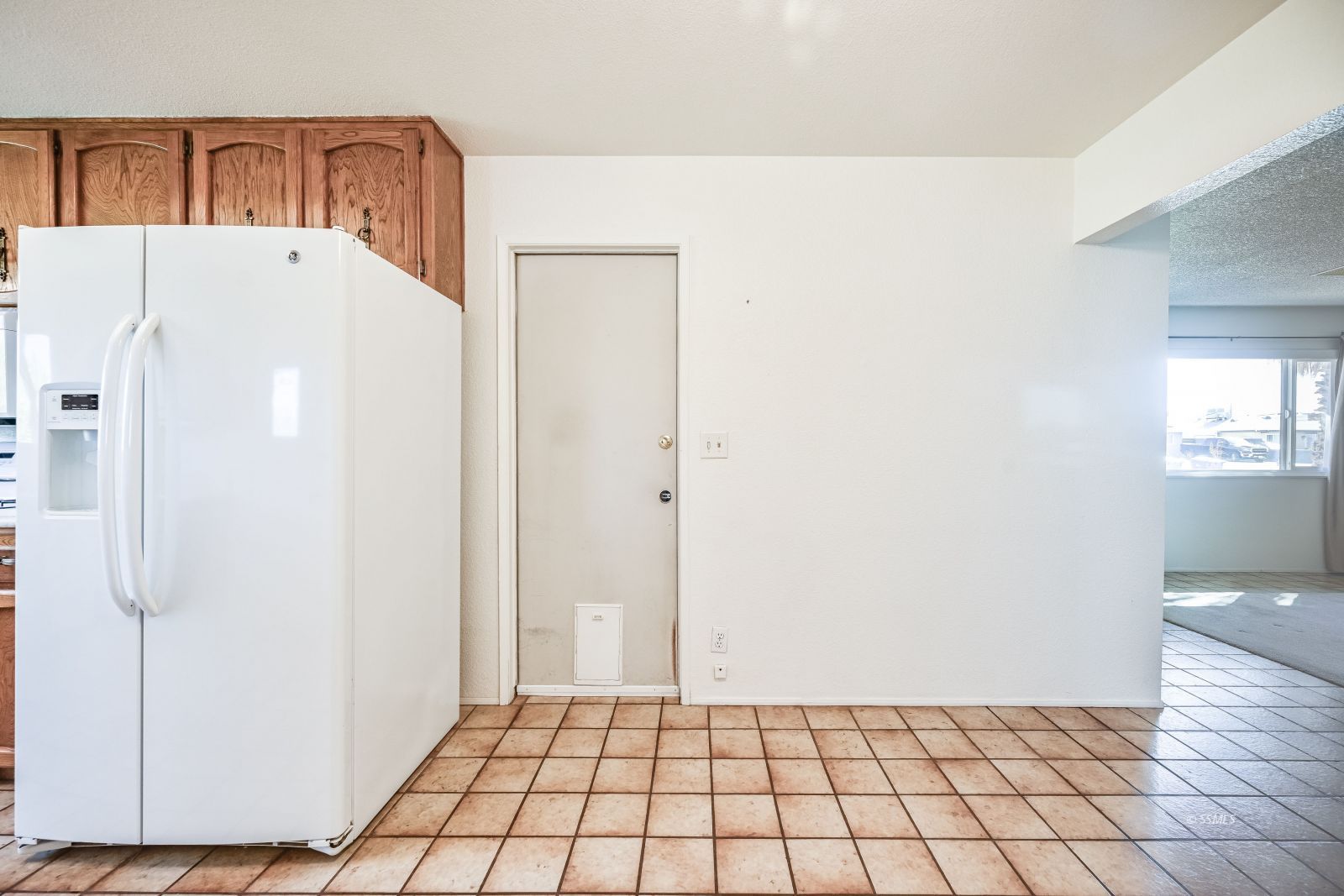 221 South Silver Ridge Street Ridgecrest, CA 93555 - Photo 19 of 44 a white refrigerator freezer sitting in a kitchen