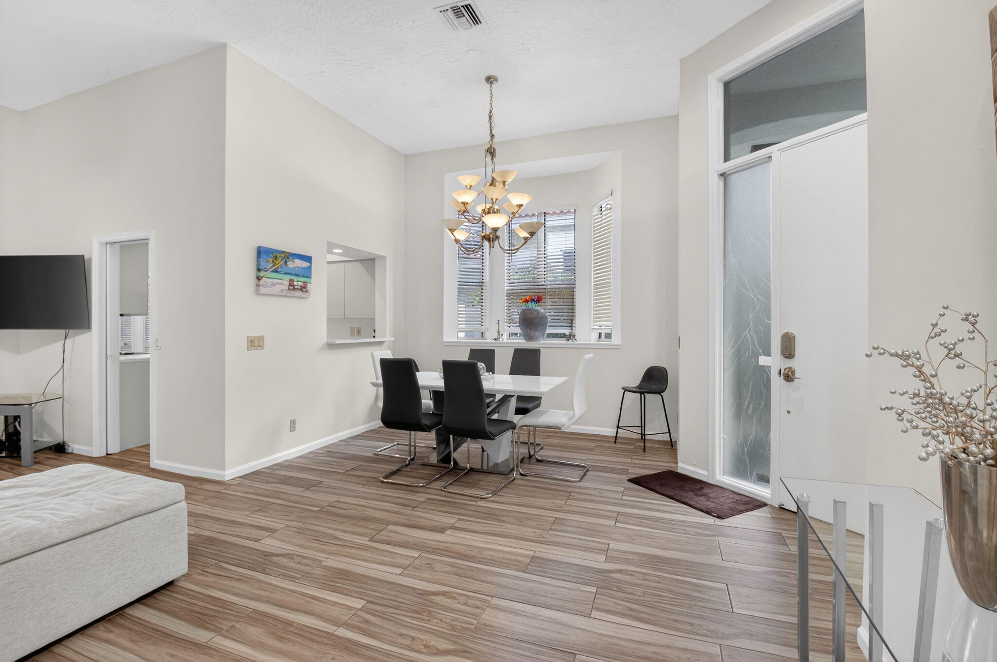 2225 Northwest 53rd Street Boca Raton, FL 33496 - Photo 15 of 46 a living room with furniture and a chandelier