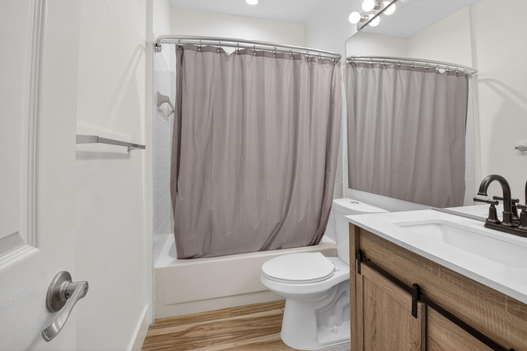2225 Northwest 53rd Street Boca Raton, FL 33496 - Photo 21 of 46 a bathroom with a sink a toilet and shower