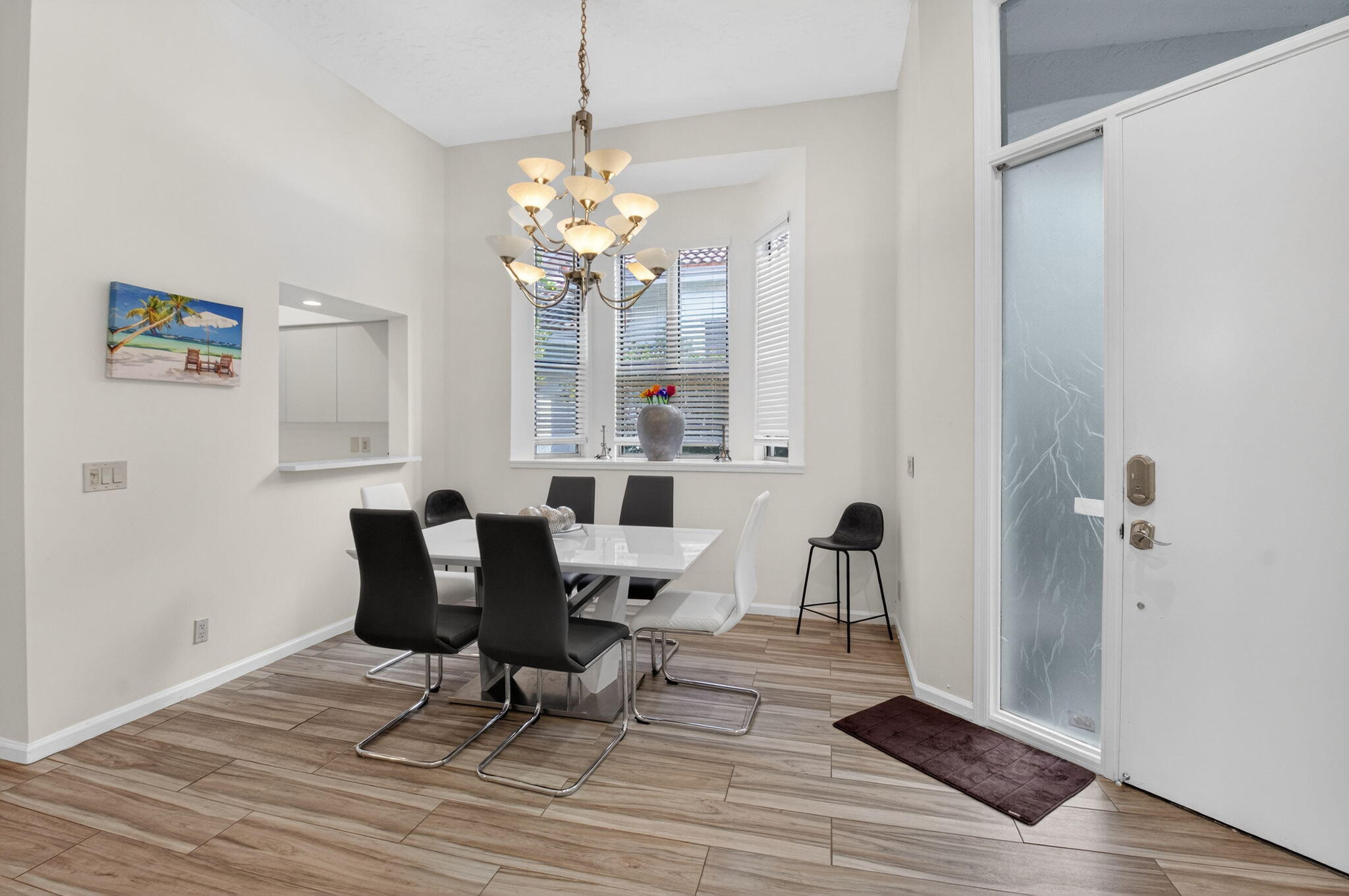 2225 Northwest 53rd Street Boca Raton, FL 33496 - Photo 4 of 46 a view of a dining room with furniture and chandelier